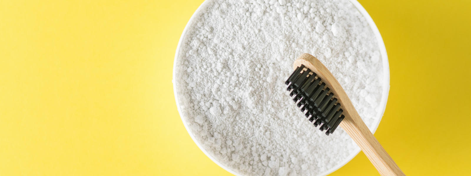 Photo of baking soda and a toothbrush